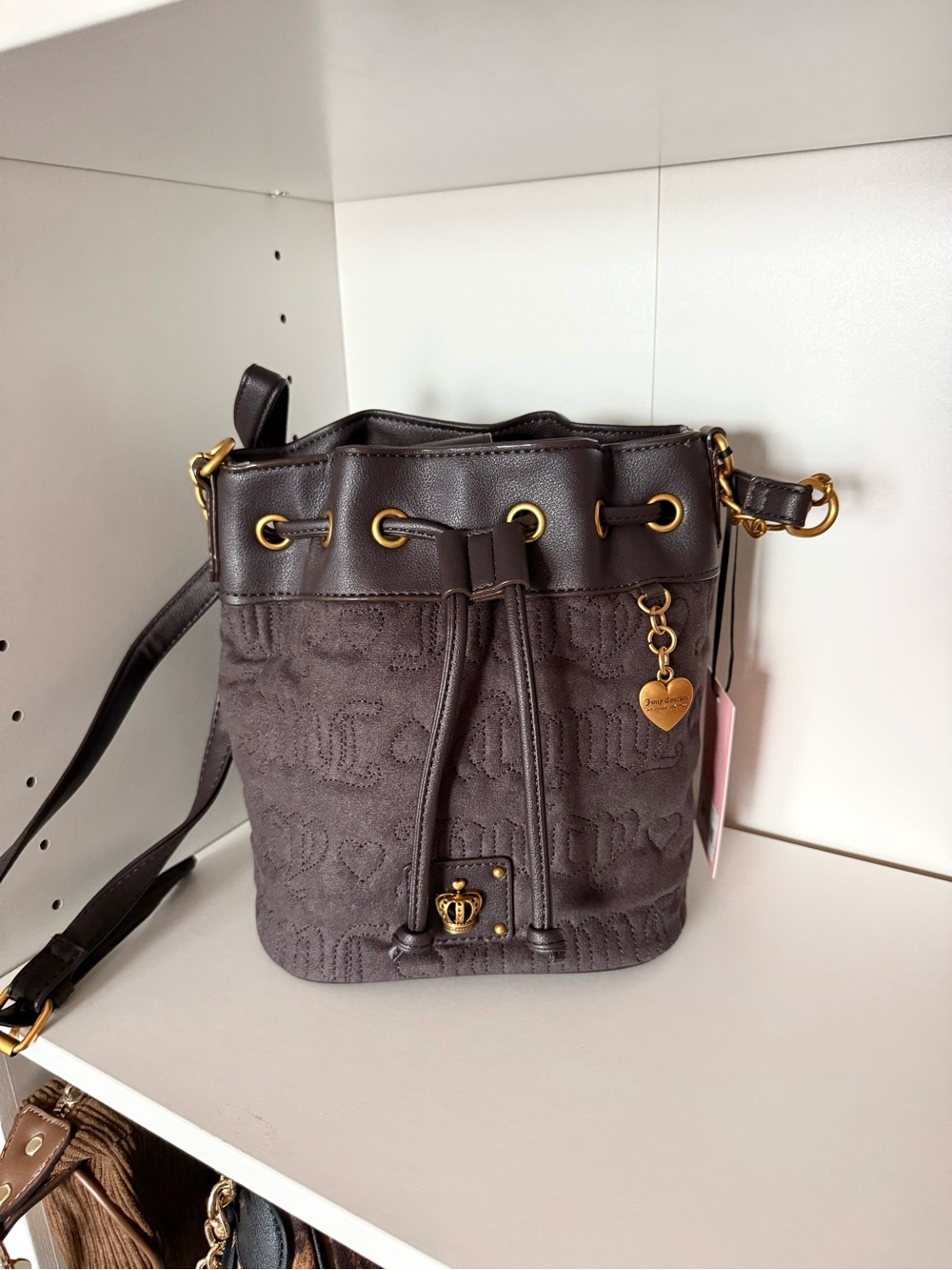 Juicy Couture “Totally Juicy” Brown Drawstring Bucket Crossbody with Heart Charm